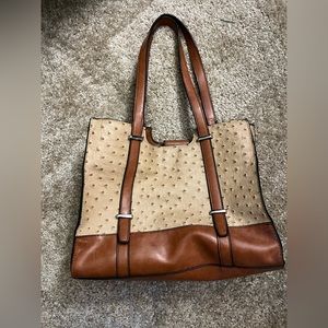 Two-tone purse with textured details.